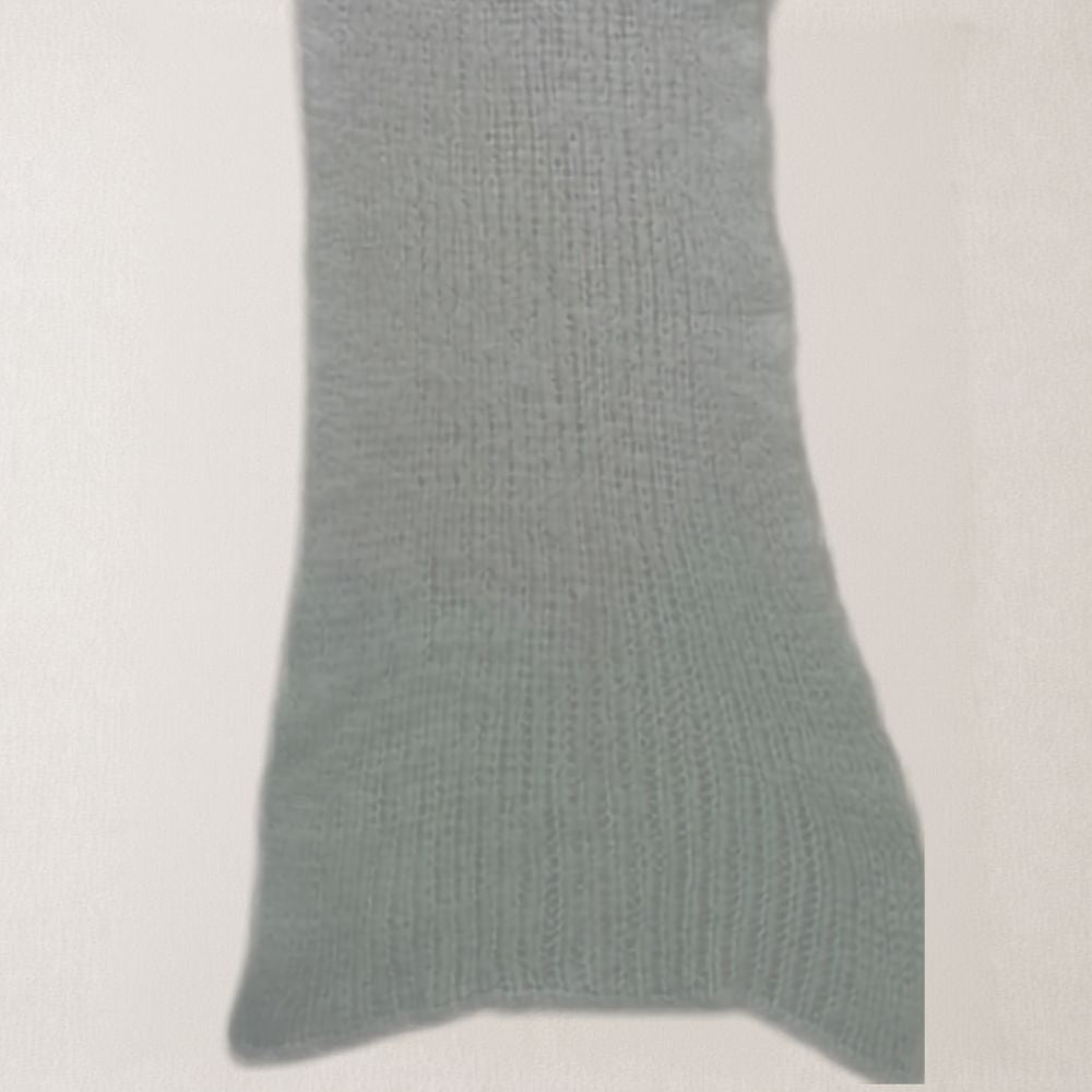 A close-up of a ribbed knit fabric in a Light Mint green color, showing the texture and weave pattern against a plain off-white background.